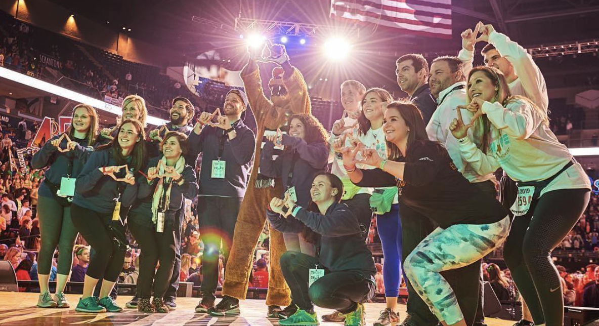 DMAIG Board of Directors and Alumni Dancers on Stage during THON Weekend